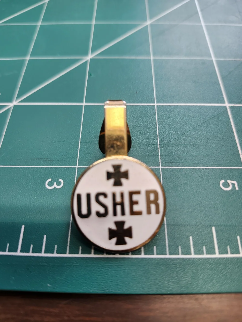 Usher Gold and White Enamel Logo Brooch Tie Clip